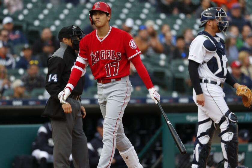 Los Angeles Angels' Shohei Ohtani walks to the dugout after striking out against the Detroit Tigers in the first inning of a baseball game in Detroit, Wednesday, May 8, 2019. (AP Photo/Paul Sancya)