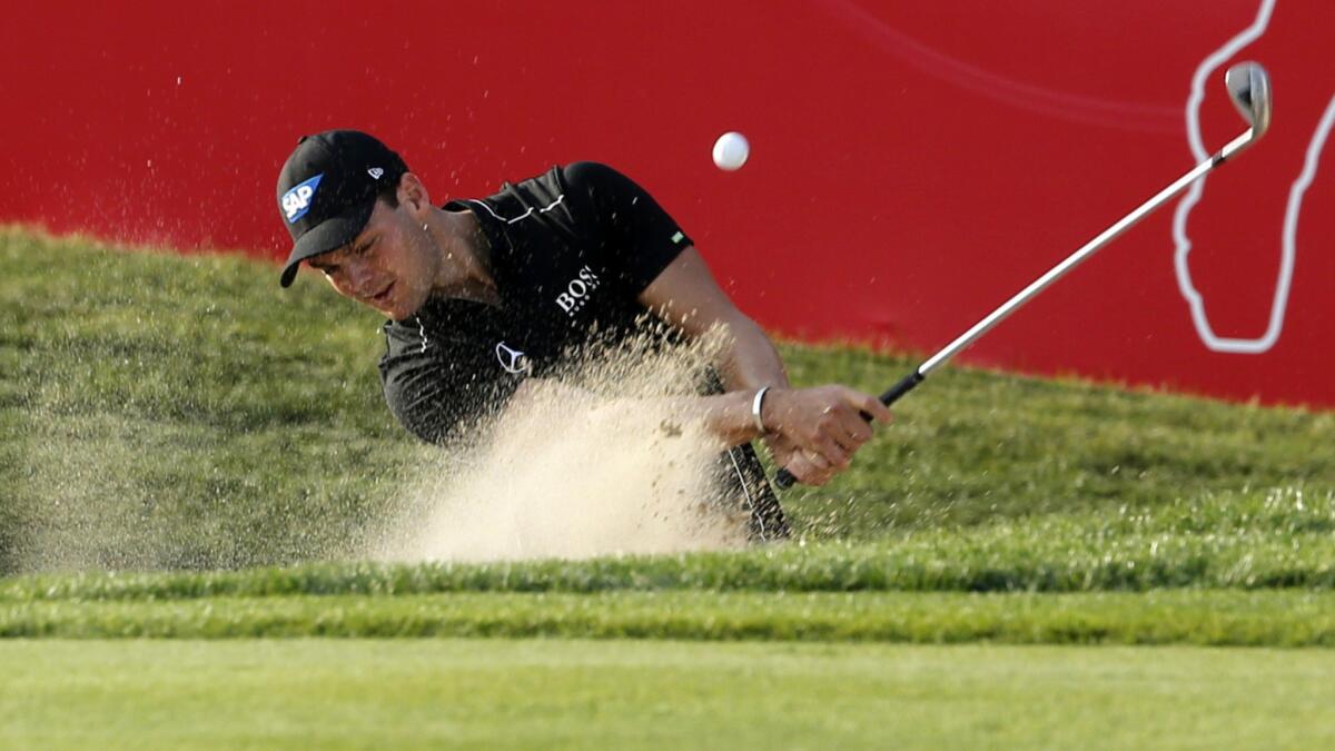 Martin Kaymer plays out of a bunker during the third round of the Abu Dhabi Championship on Saturday.