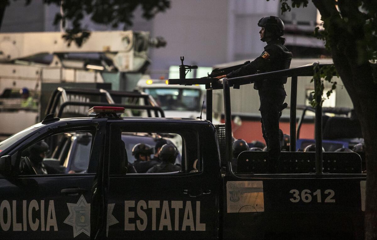 Police patrol after the fierce gun battle in Culiacan, capital of Sinaloa. 