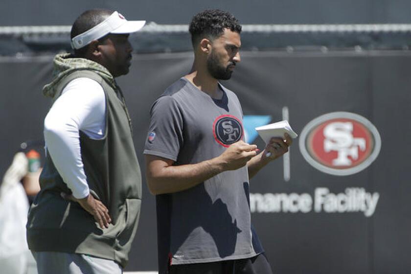 San Francisco 49ers assistant coaches Jon Embree, left, and Taylor Embree at the team's NFL football headquarters in Santa Clara, Calif., Tuesday, June 4, 2019. (AP Photo/Jeff Chiu)