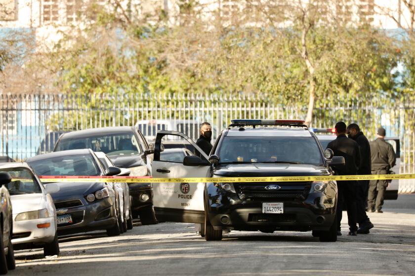 LOS ANGELES CA JANUARY 28, 2021 - An investigation is underway after a man armed with a knife and assaulting his girlfriend was shot and killed by LAPD officers in the Vermont Square area Wednesday evening in the area of 40th Place and Vermont Avenue. (Al Seib / Los Angeles Times)