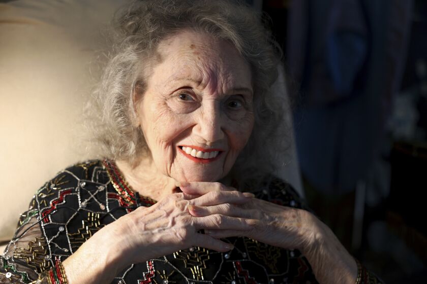 Magician Gloria Dea poses at her Las Vegas home on Tuesday, Aug. 9, 2022. Dea, touted as the first magician to perform on what would become the Las Vegas Strip in the early 1940s, has died. One of Dea's caretakers said she died Saturday, March 18, 2023, at her Las Vegas residence. She was 100. (K.M. Cannon/Las Vegas Review-Journal via AP)