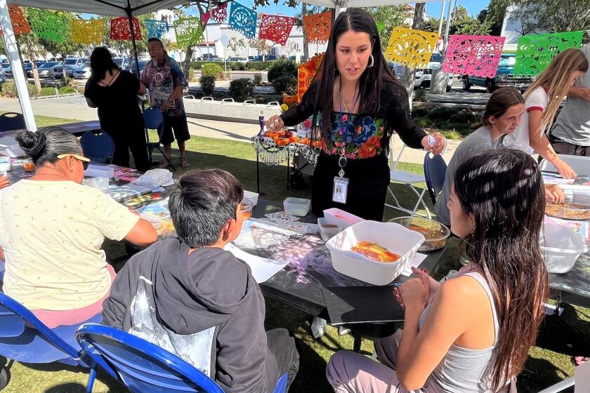 Youth and adults participate in an art-making activity at Costa Mesa's ARTventure in 2023. 