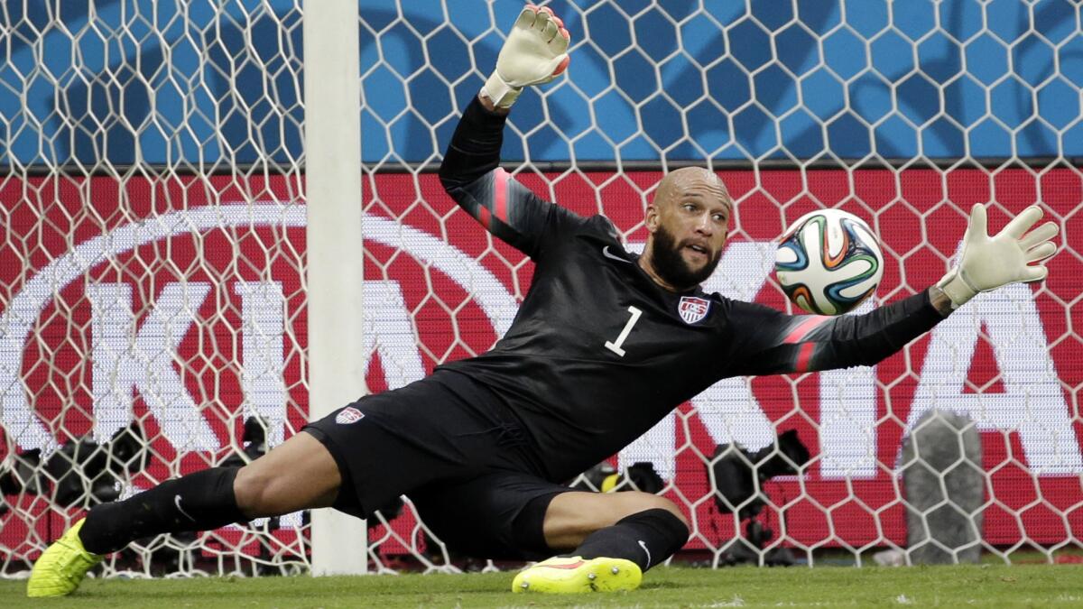 U.S. goalkeeper Tim Howard makes a save during the team's 2-1 World Cup loss to Belgium on Tuesday. Howard has become an instant sports celebrity following his remarkable, 16-save performance against Belgium.