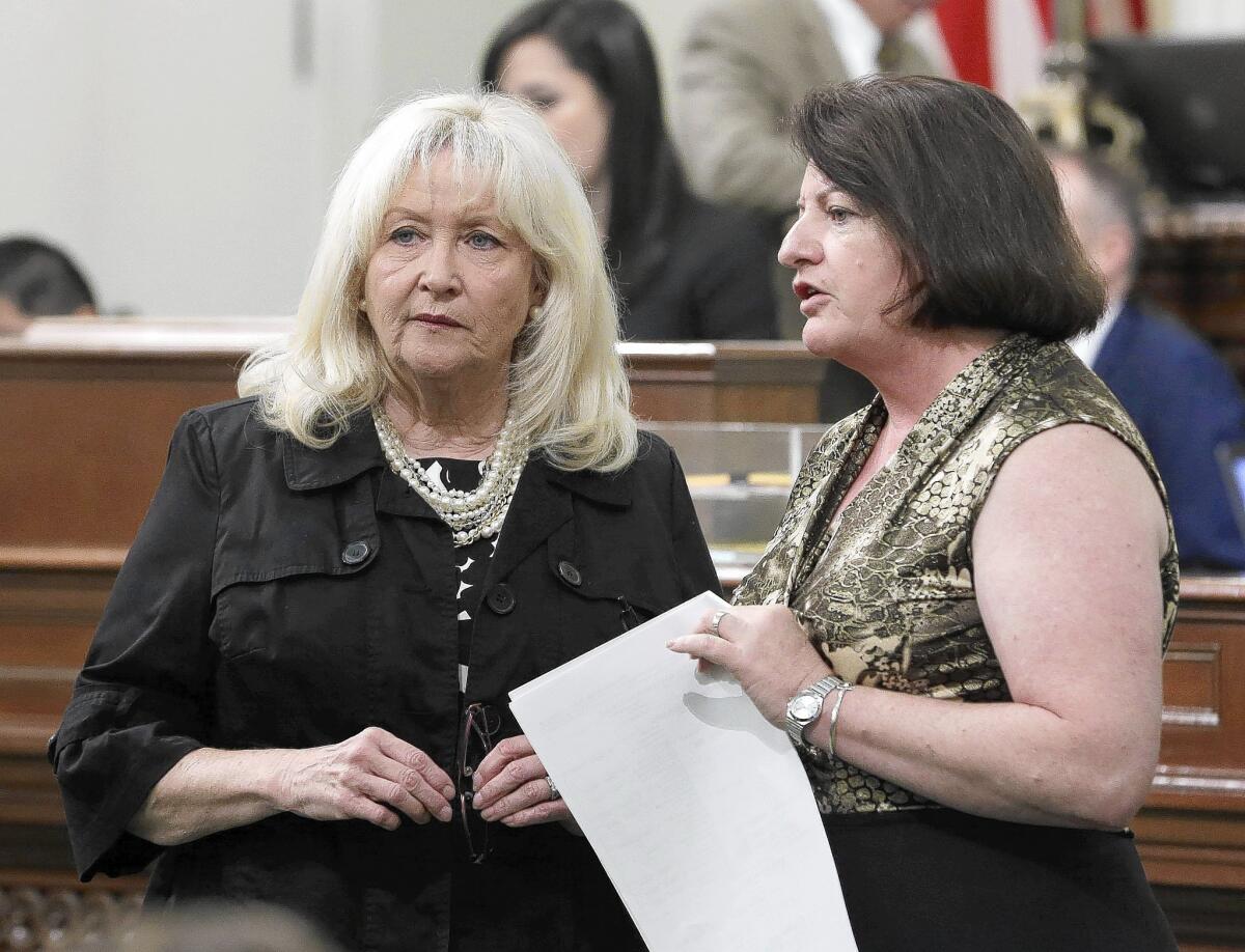 Assembly Minority Leader Connie Conway, left, and Assembly Speaker Toni Atkins confer during the Assembly session at the Capitol in Sacramento.