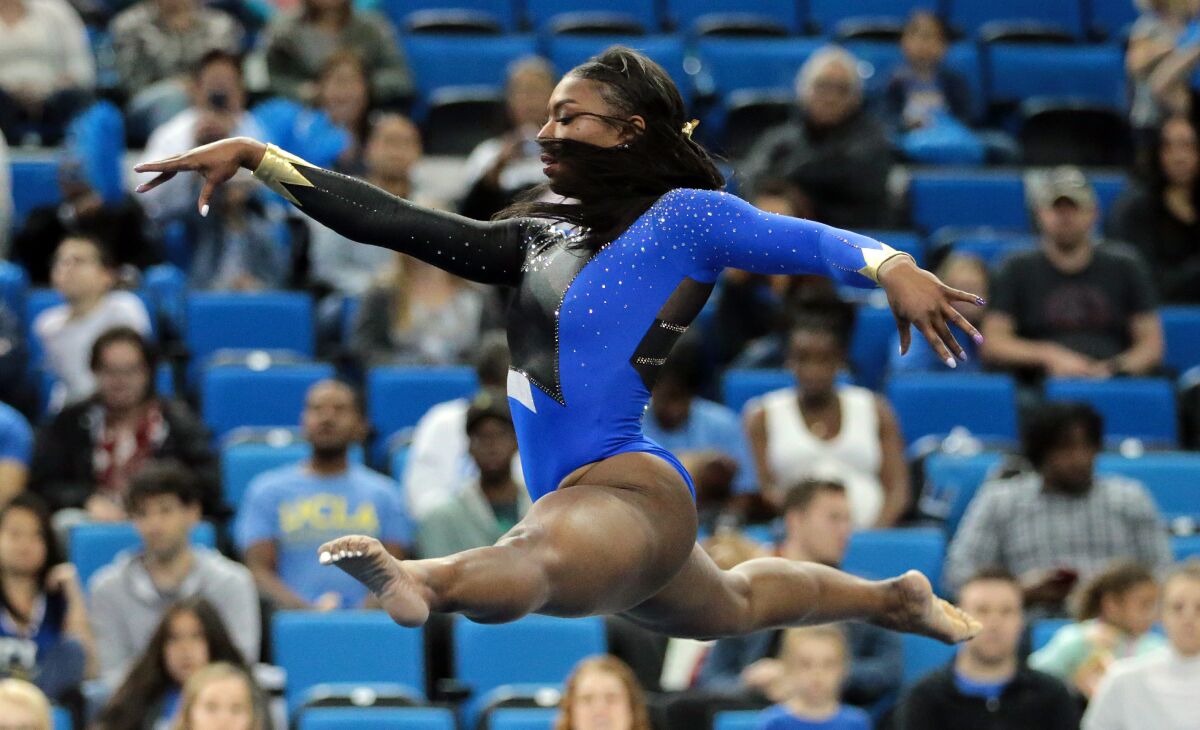 Nia Dennis performs the floor exercise during the UCLA gymnastics exhibition at Pauley Pavilion on Saturday.