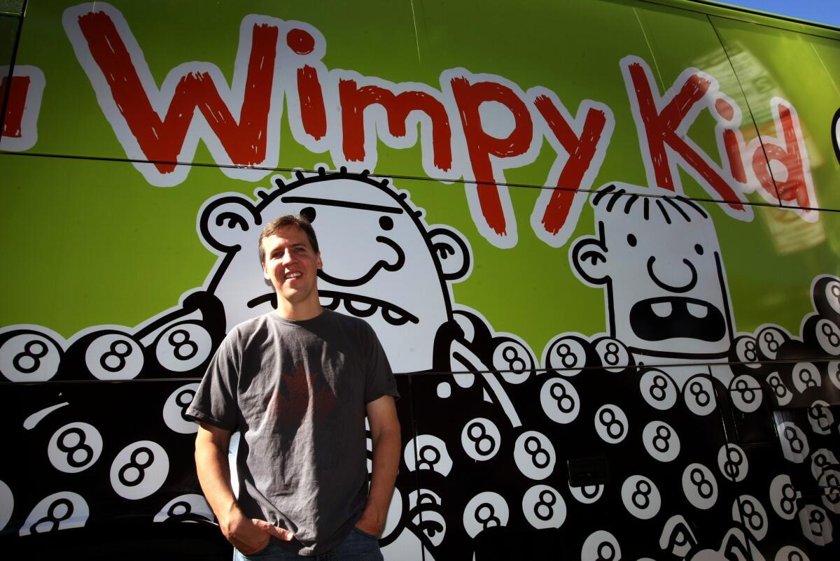 Author Jeff Kinney with his "Diary of a Wimpy Kid" tour bus in Los Angeles on Nov. 5, 2013.