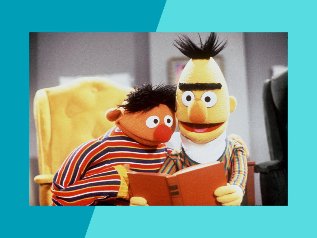 two muppets reading a book