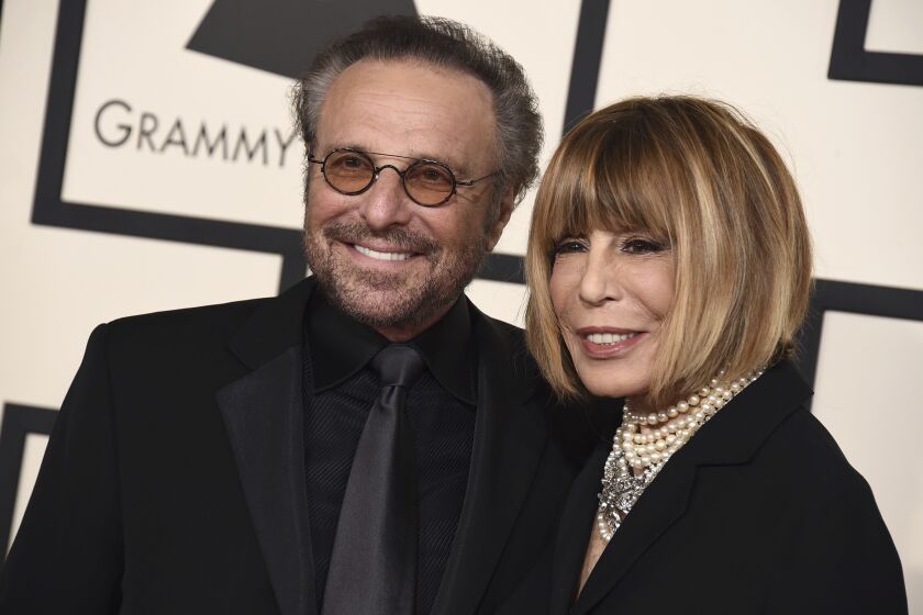 FILE - Barry Mann, left, and Cynthia Weil arrive at the 57th annual Grammy Awards at the Staples Center on Sunday, Feb. 8, 2015, in Los Angeles. Weil, a Grammy-winning lyricist of great range and endurance who enjoyed a decades-long partnership with husband Mann and helped write "You've Lost That Lovin' Feeling," "On Broadway," "Walking in the Rain" and dozens of other hits, has died at age 82. Weil and Mann, married in 1961, were one of popular music's most successful teams. (Photo by Jordan Strauss/Invision/AP, File)