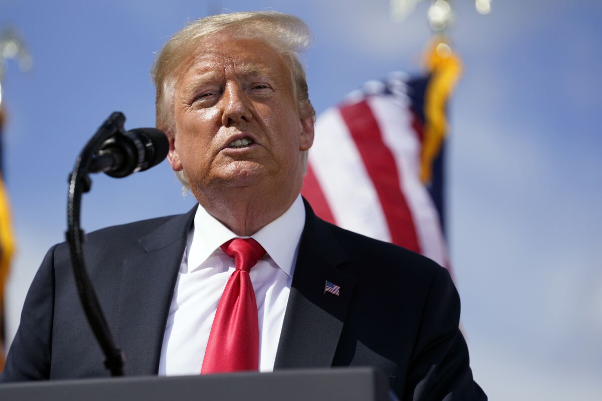 President Trump gives a speech Thursday at a shipbuilding firm in Marinette, Wis.