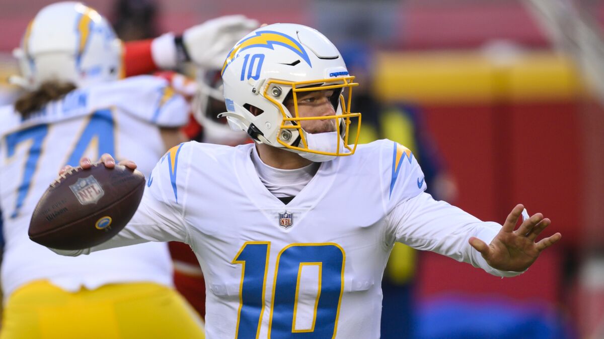 Chargers quarterback Justin Herbert looks to pass during a game against the Kansas City Chiefs