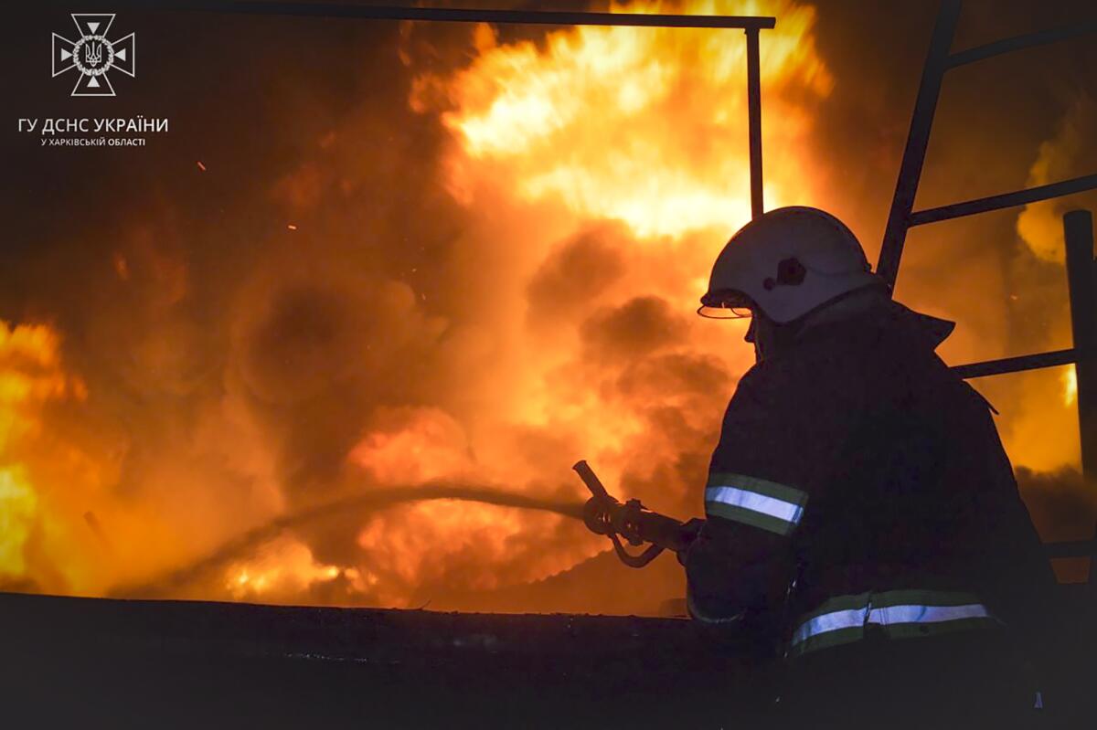 Firefighter trying to extinguish blaze in Kharkiv, Ukraine