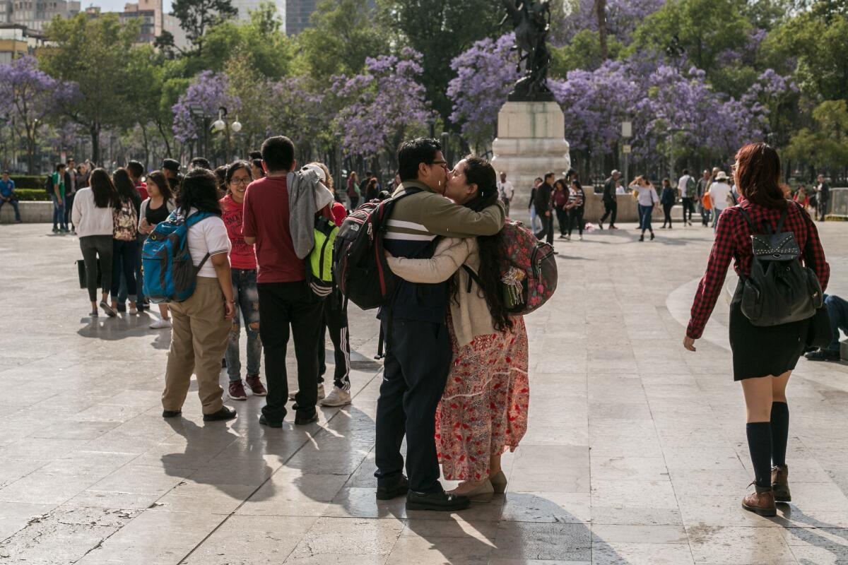 Eduardo, 30, and Lili, 28, embrace in Mexico City's Alameda Central park where Eduardo brings Lili flowers on Fridays.