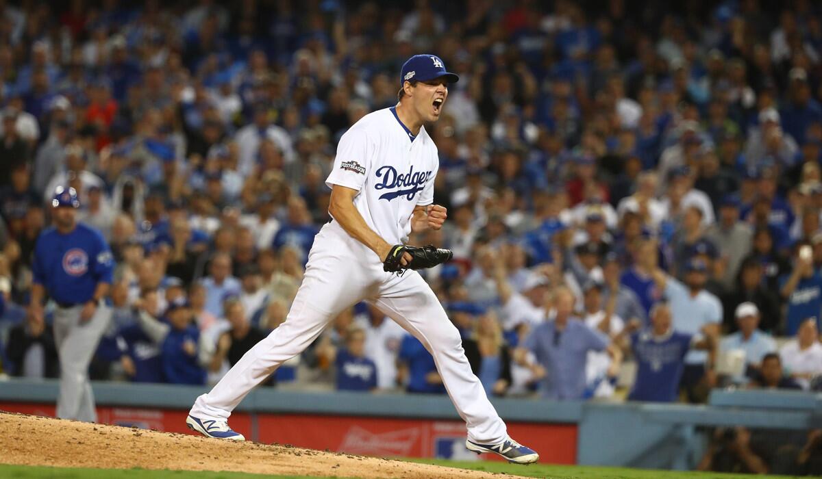 Dodgers pitcher Rich Hill exhults after striking out Cubs' Anthony Rizzo to end the sixth inning of Game 3 of the NLCS at Dodger Stadium.