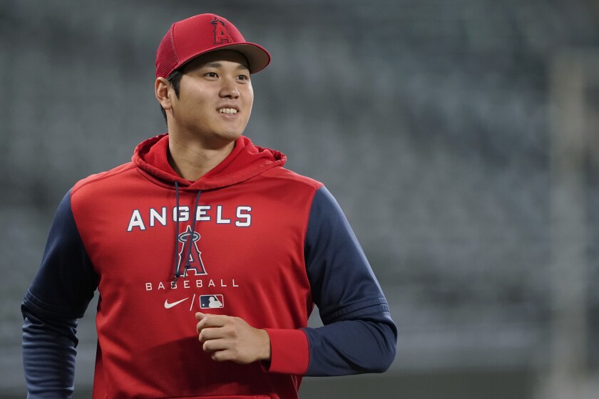 Angels star Shohei Ohtani jogs on the field before Friday's game against the Seattle Mariners.