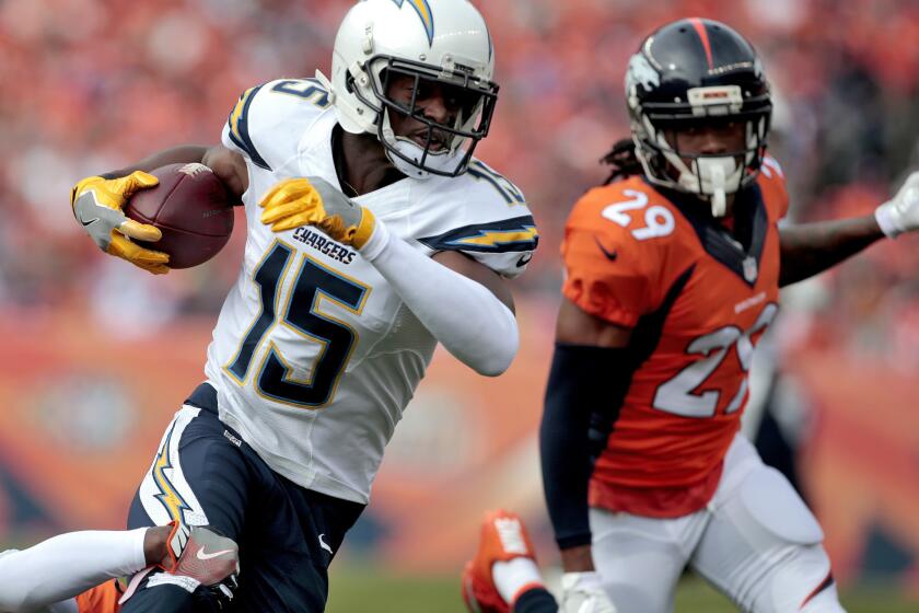 San Diego Chargers wide receiver Dontrelle Inman (15) runs as Denver Broncos free safety Bradley Roby (29) pursues during the first half of an NFL football game, Sunday, Oct. 30, 2016, in Denver. (AP Photo/Joe Mahoney)