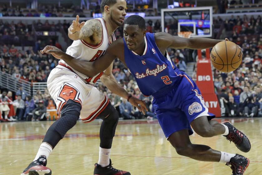 Darren Collison drives against Chicago's D.J. Augustin during the first half of the Clippers' 112-95 win Friday over the Bulls. Collison had 17 points with four assists.