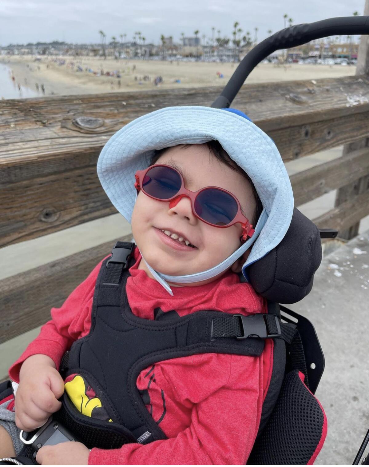 An infant boy in a stroller