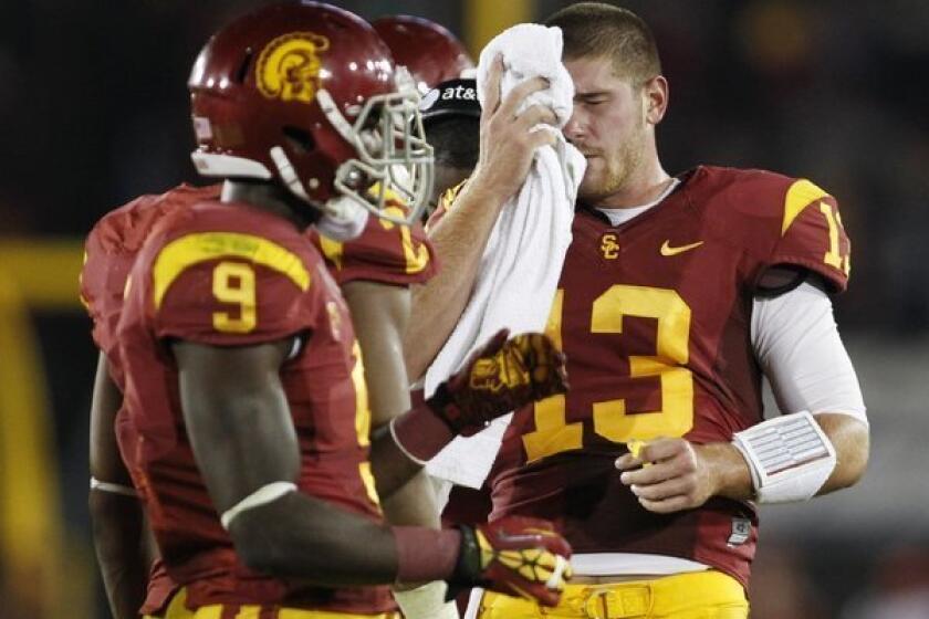 USC quarterback Max Wittek, right, wipes his face as wide receiver Marqise Lee stands nearby during a game in November.