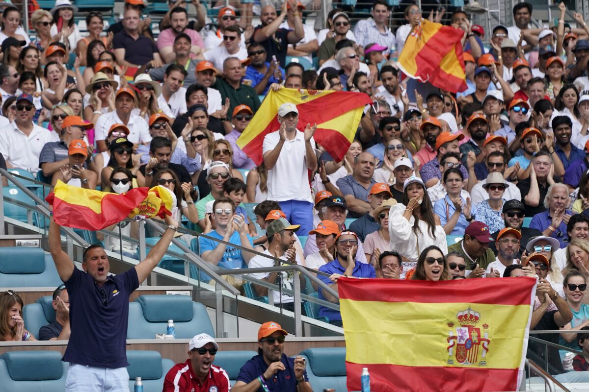 Tennis fans cheer for Carlos Alcaraz, of Spain, as he plays against Casper Ruud, of Norway, during the men's singles finals of the Miami Open tennis tournament, Sunday, April 3, 2022, in Miami Gardens, Fla. (AP Photo/Wilfredo Lee)