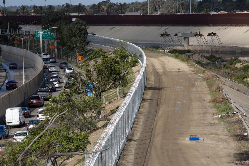 Tijuana, Baja California - December 01: Mexican officials recently installed a chainlink fence along the Tijuana River to discourage migrant crossing on Friday, Dec. 1, 2023 in Tijuana, Baja California. (Ana Ramirez / The San Diego Union-Tribune)