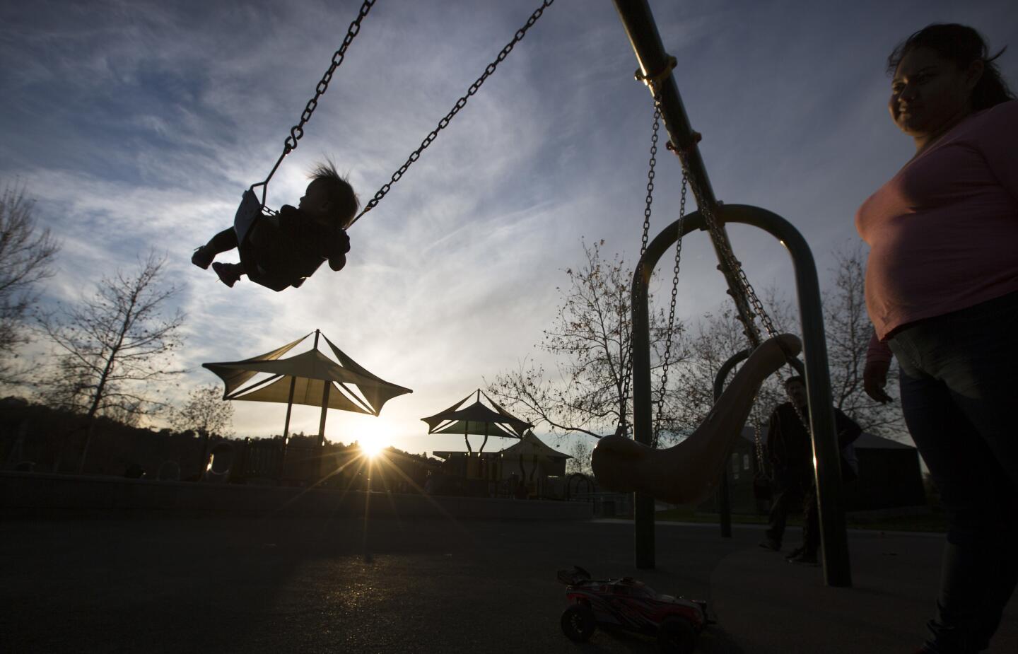 A mom and her toddler give the swings a workout at Rio de Los Angeles State Park.