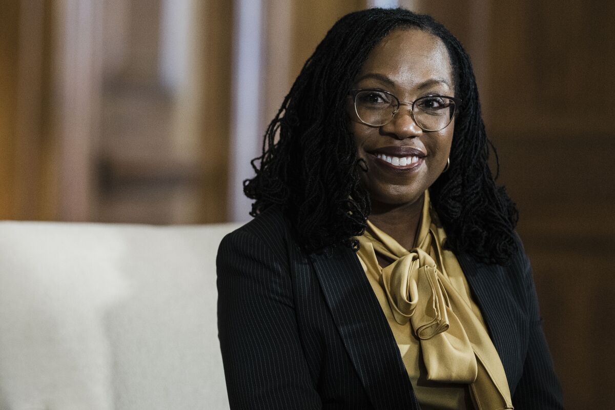 Judge Ketanji Brown Jackson smiles while sitting