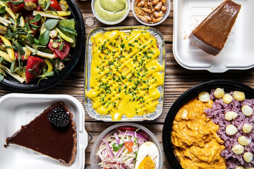 LOS ANGELES, CA - JULY 09: The menu from 'de Porres' includes: (clockwise from right) Grace's caramel poundcake, Peruvian chicken stew, ganache tart, summer salad and vegan beet and avocado causa on Thursday, July 9, 2020 in Los Angeles, CA. (Mariah Tauger / Los Angeles Times)