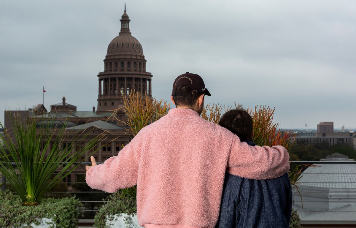 Shia LaBeouf, left, and Zack Gottsagen look out over the Texas Capitol during South by Southwest in Austin, Texas, on Sunday. The pair premiered their film, "The Peanut Butter Falcon," at the SXSW film festival on Saturday.