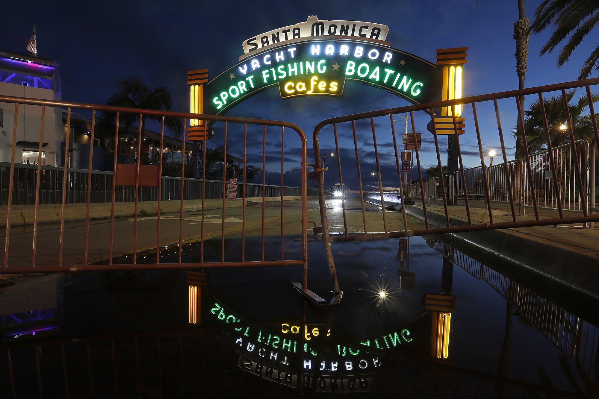 The lights are on but the Santa Monica Pier is closed to the public. Gov. Gavin Newson has ordered California residents to stay home as a precaution against the spread of coronavirus.