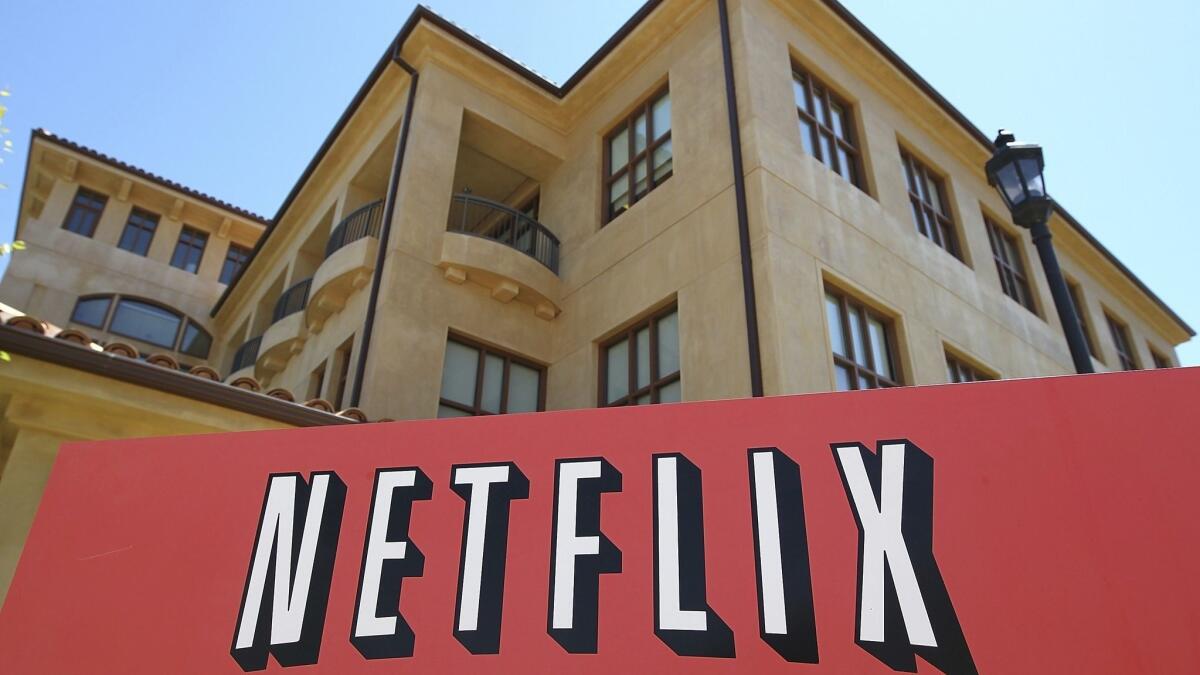 A sign is posted in front of the Netflix headquarters in July 2011 in Los Gatos, Calif.