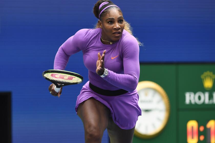 Serena Williams, of the United States, dashes to the net on a return to Petra Martic, of Croatia, during round four of the US Open tennis championships Sunday, Sept. 1, 2019, in New York. (AP Photo/Sarah Stier)
