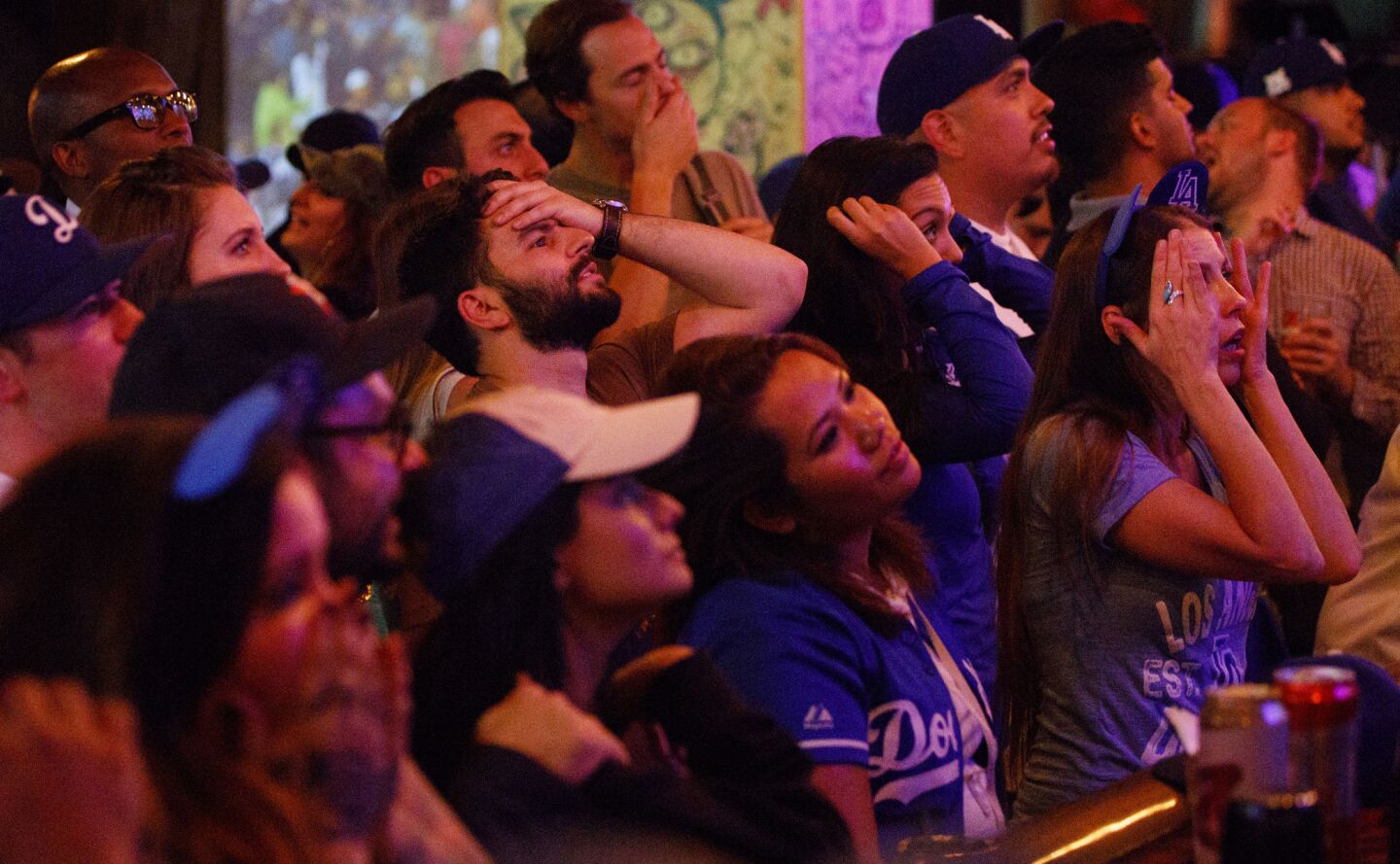Dodgers fans react at the Down N Out bar in downtown during Game 7.