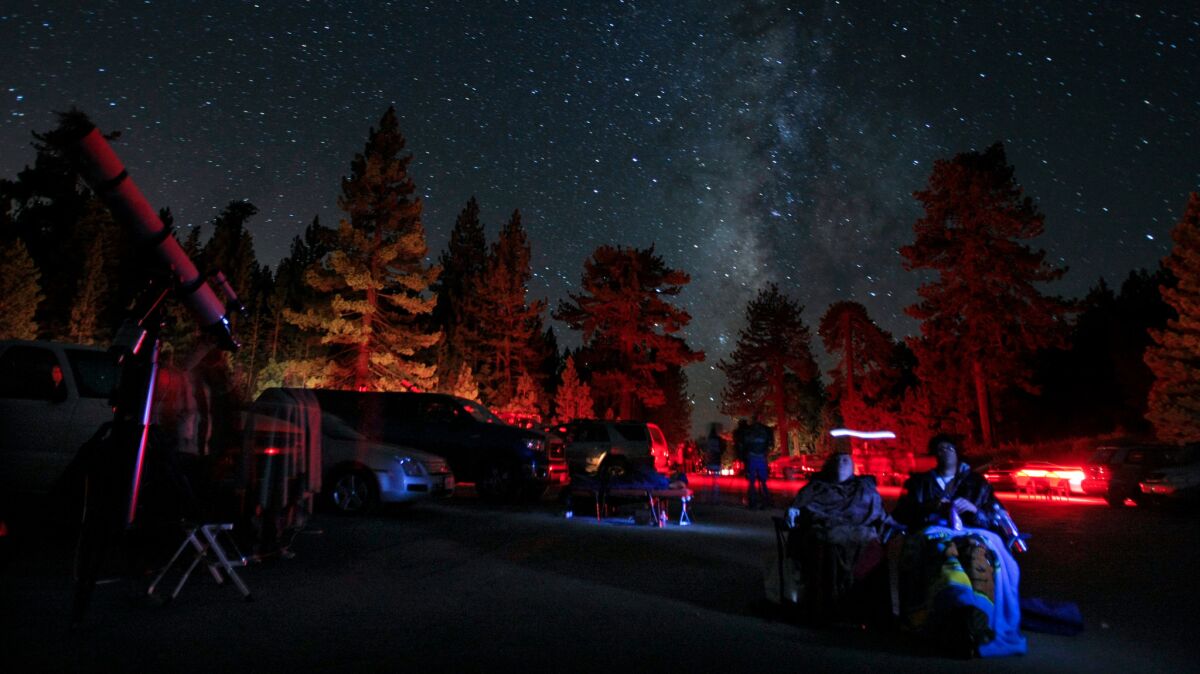 Stargazers sit beneath the Milky Way at Mount Pinos in 2010.