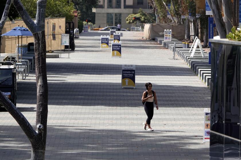 SAN DIEGO, CA - AUGUST 12: Library walks and Geisel Library at UC San Diego void of people on Wednesday, Aug. 12, 2020 in San Diego, CA. San Diego area colleges have turned into ghost towns since the coronavirus pandemic, (K.C. Alfred / The San Diego Union-Tribune)