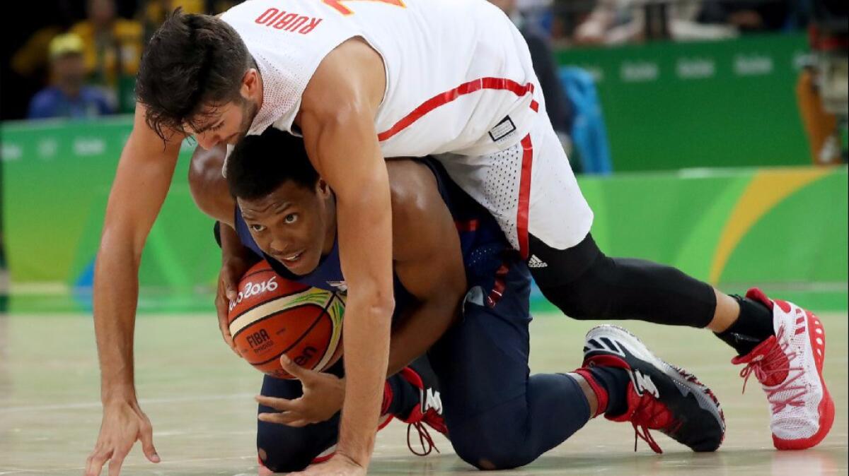 Kyle Lowry is boxed in by Spain's Ricky Rubio during a semifinal game at the 2016 Summer Games.