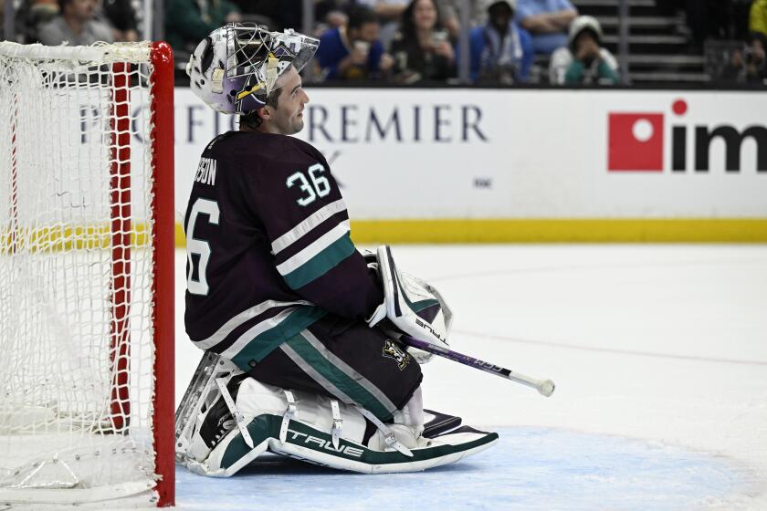 FILE - Anaheim Ducks goaltender John Gibson watches the video scoreboard after the Minnesota Wild.