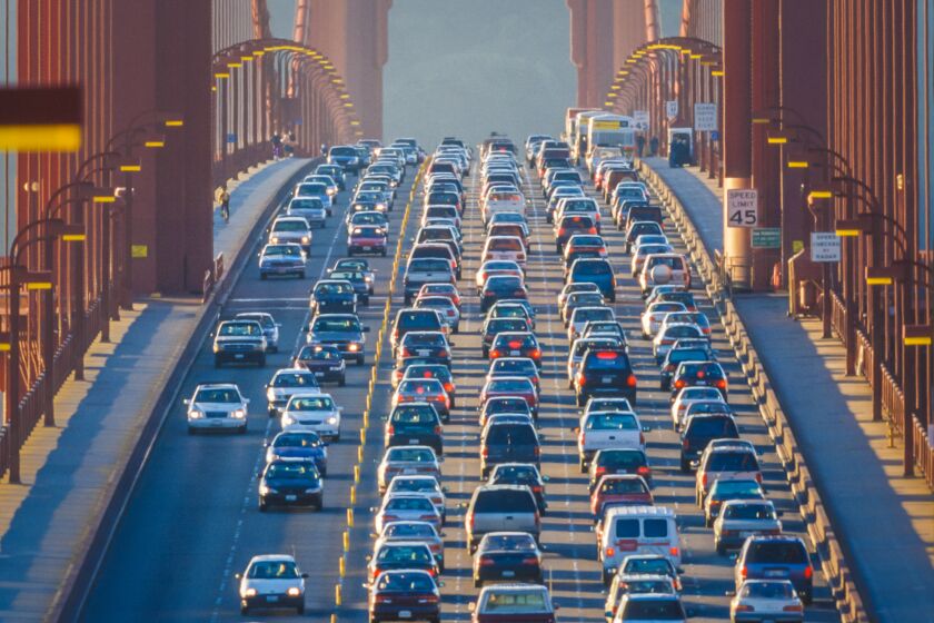 Traffic jam during rush hour commute on the Golden Gate Bridge in San Francisco, California, USA.
