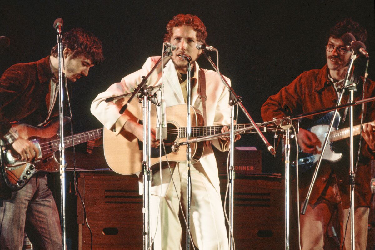 Bob Dylan with Rick Danko and Robbie Robertson of The Band
