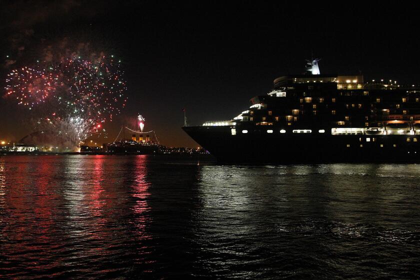 The Queen Elizabeth (foreground) entered Long Beach harbor in 2013. It will visit and dock next week for the first time.