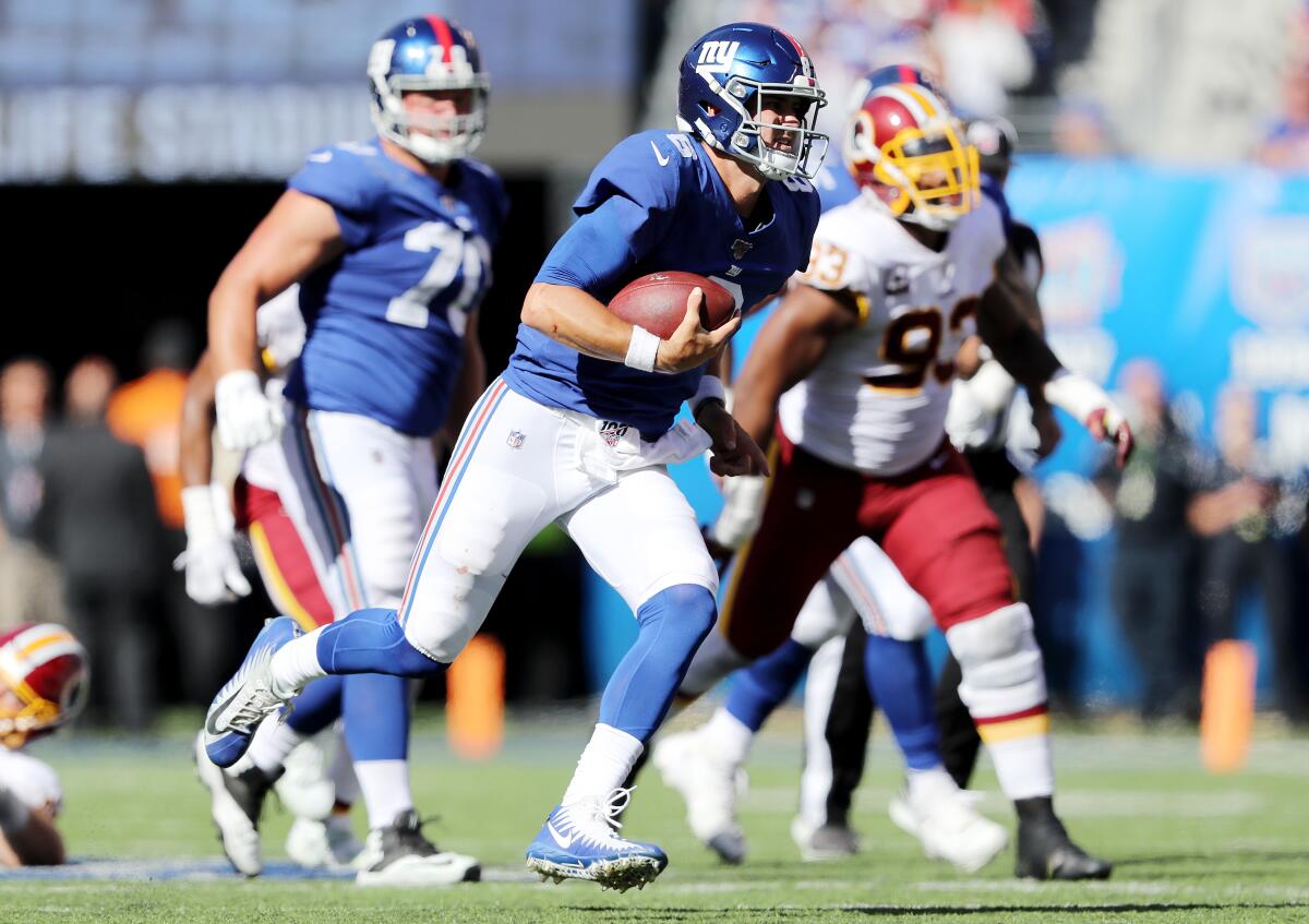 New York Giants quarterback Daniel Jones scrambles against the Washington Redskins on Sunday.