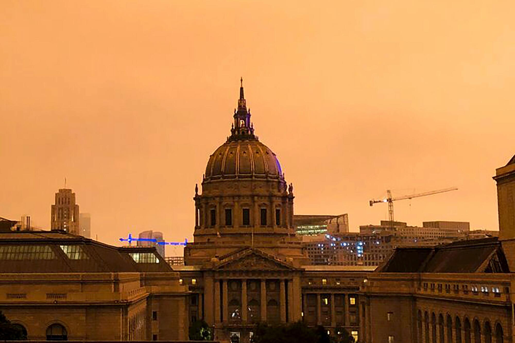 The sky around San Francisco City Hall is shrouded in smoke Wednesday morning.