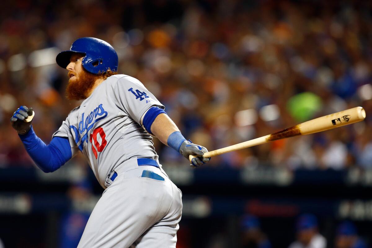 Dodgers third baseman Justin Turner hit a double in the third inning to drive in Howie Kendrick and Adrian Gonzalez in Game 4 of the National League division series against the Mets.