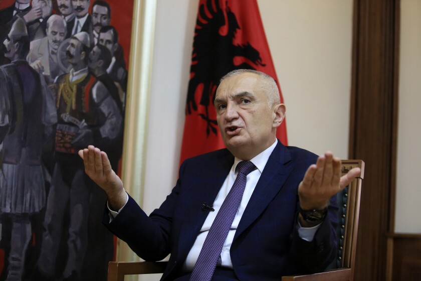 Albanian President Ilir Meta speaks during an interview with the Associated Press in Tirana, Albania, Wednesday, April 21, 2021. Albania’s president waded deep into the country's parliamentary election campaign Wednesday, accusing the left-wing government of running a “kleptocratic regime” and bungling its pandemic response. In an interview with The Associated Press, Ilir Meta also said he would step down if Prime Minister Edi Rama's Socialists — who are leading the main opposition conservatives in opinion polls — win Sunday's vote. (AP Photo/Hektor Pustina)