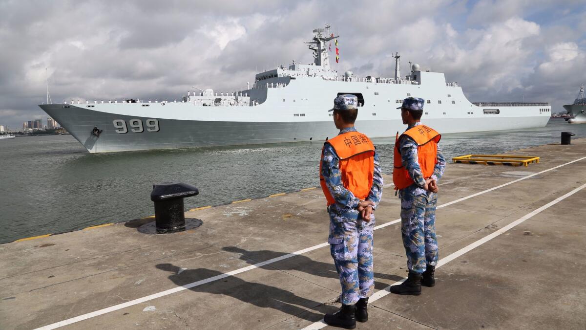A ship carrying Chinese military personnel departs a port July 11 in Zhanjiang, south China's Guangdong province.