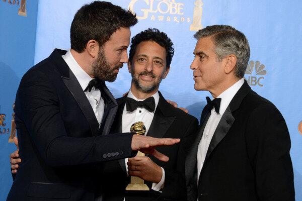 Ben Affleck, Grant Heslov and George Clooney, winners for best drama ('Argo')