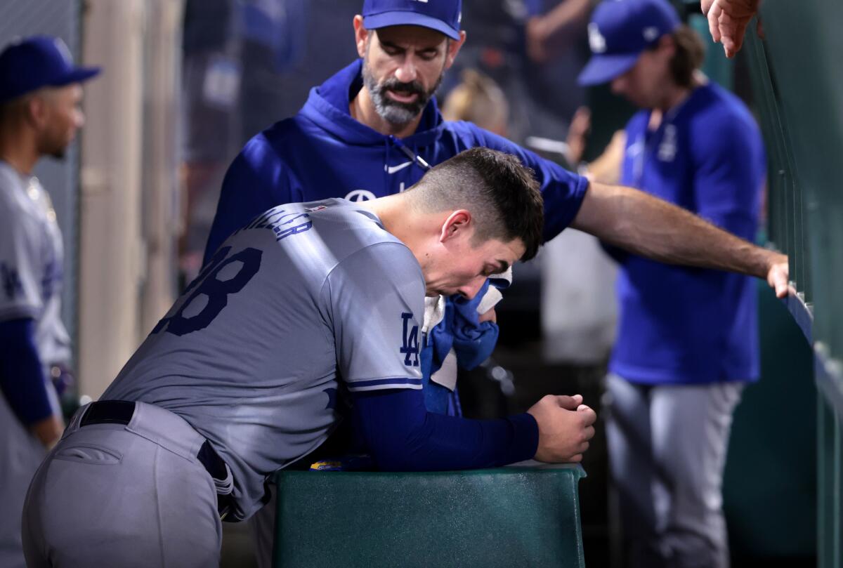 Pitching coach Mark Prior talks to Dodgers pitcher Bobby Miller on Wednesday.