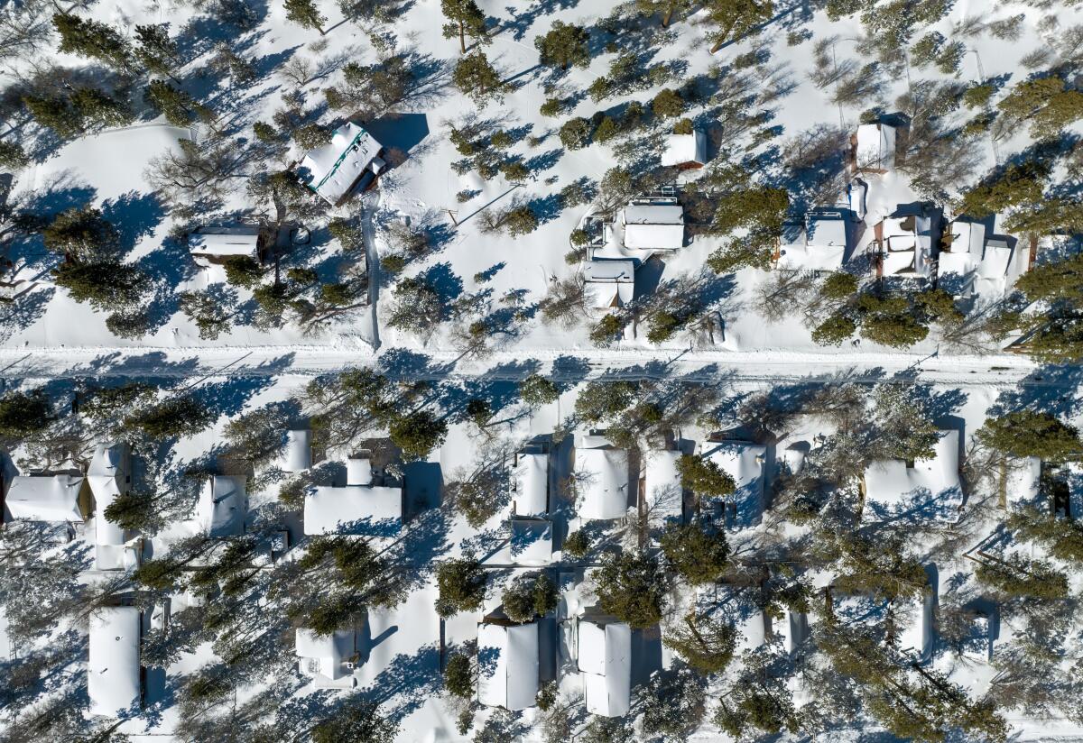 Aerial view of snow covering a residential mountain community