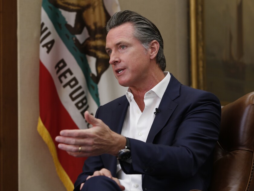 FILE - In this Oct. 8, 2019, file photo, California Gov. Gavin Newsom speaks during an interview in Sacramento, Calif. Newsom said on Wednesday, Jan. 8, 2020, that he is seeking $750 million to help pay rent for people facing homelessness, among other purposes, in the most populous state's latest attempt to fight what he called a national crisis. (AP Photo/Rich Pedroncelli, File)