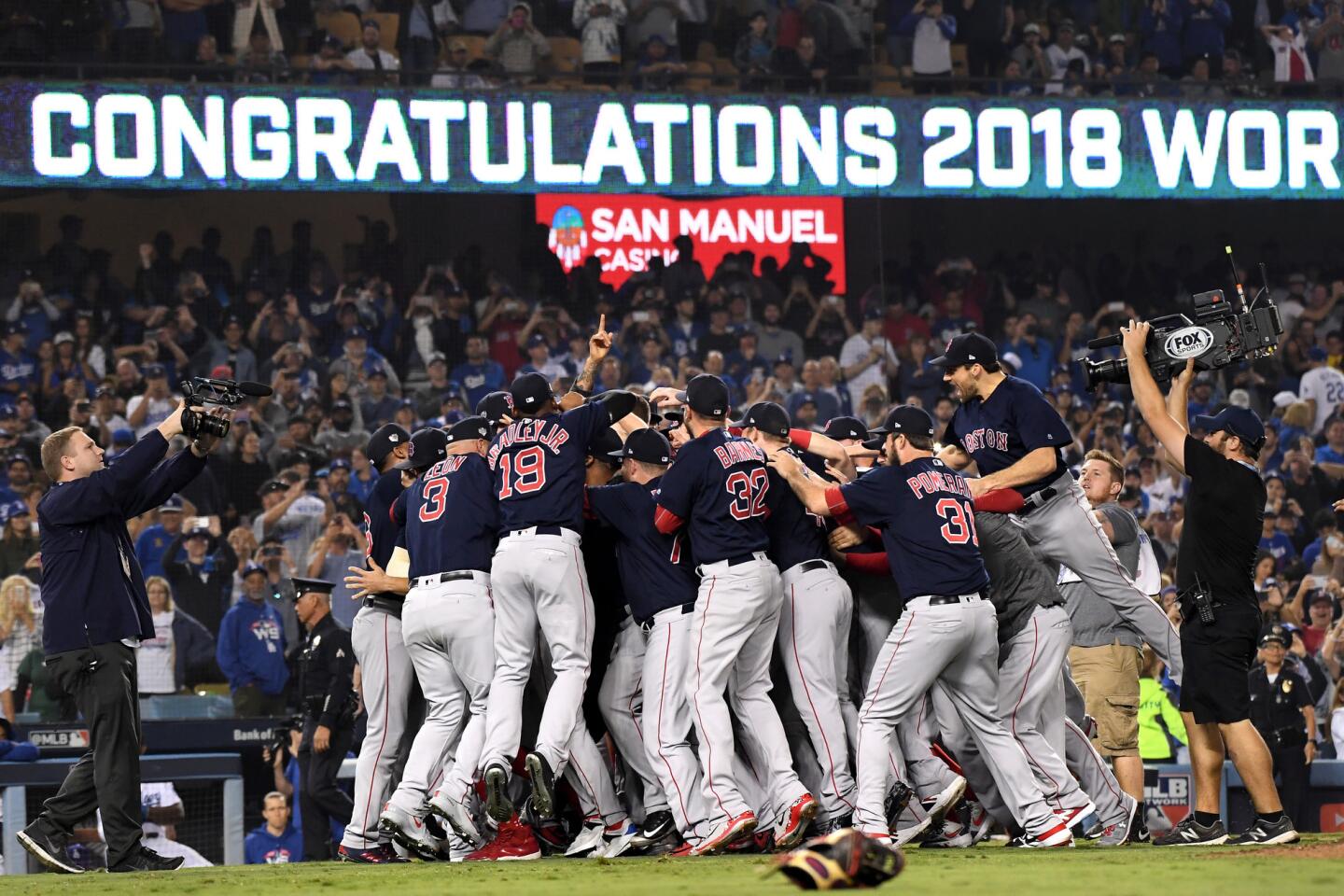 The Red Sox celebrate the championship after defeating the dodgers in Game 5 of the World Series.